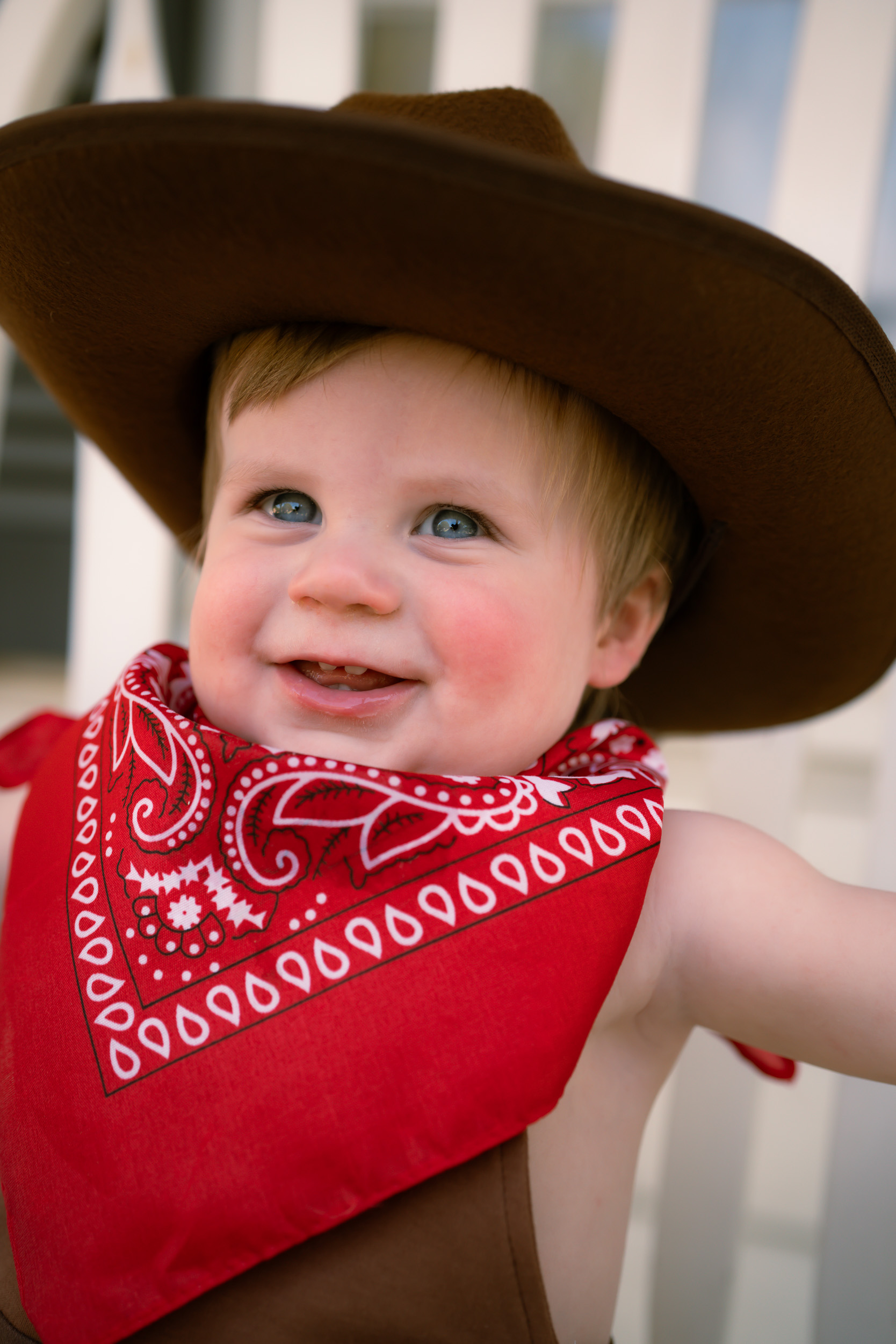 Toddler in a cowboy hat and bandana