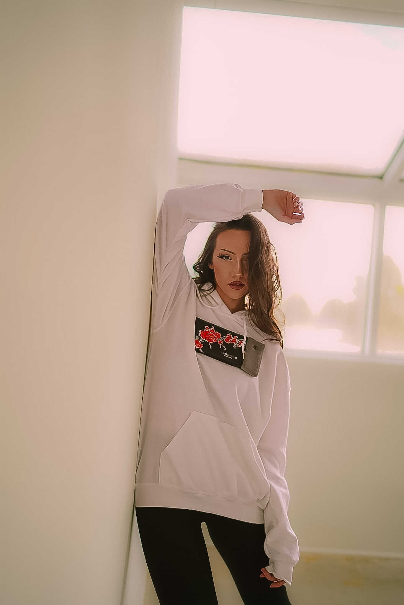 Fashion editorial in a white cherry-blossom hoodie